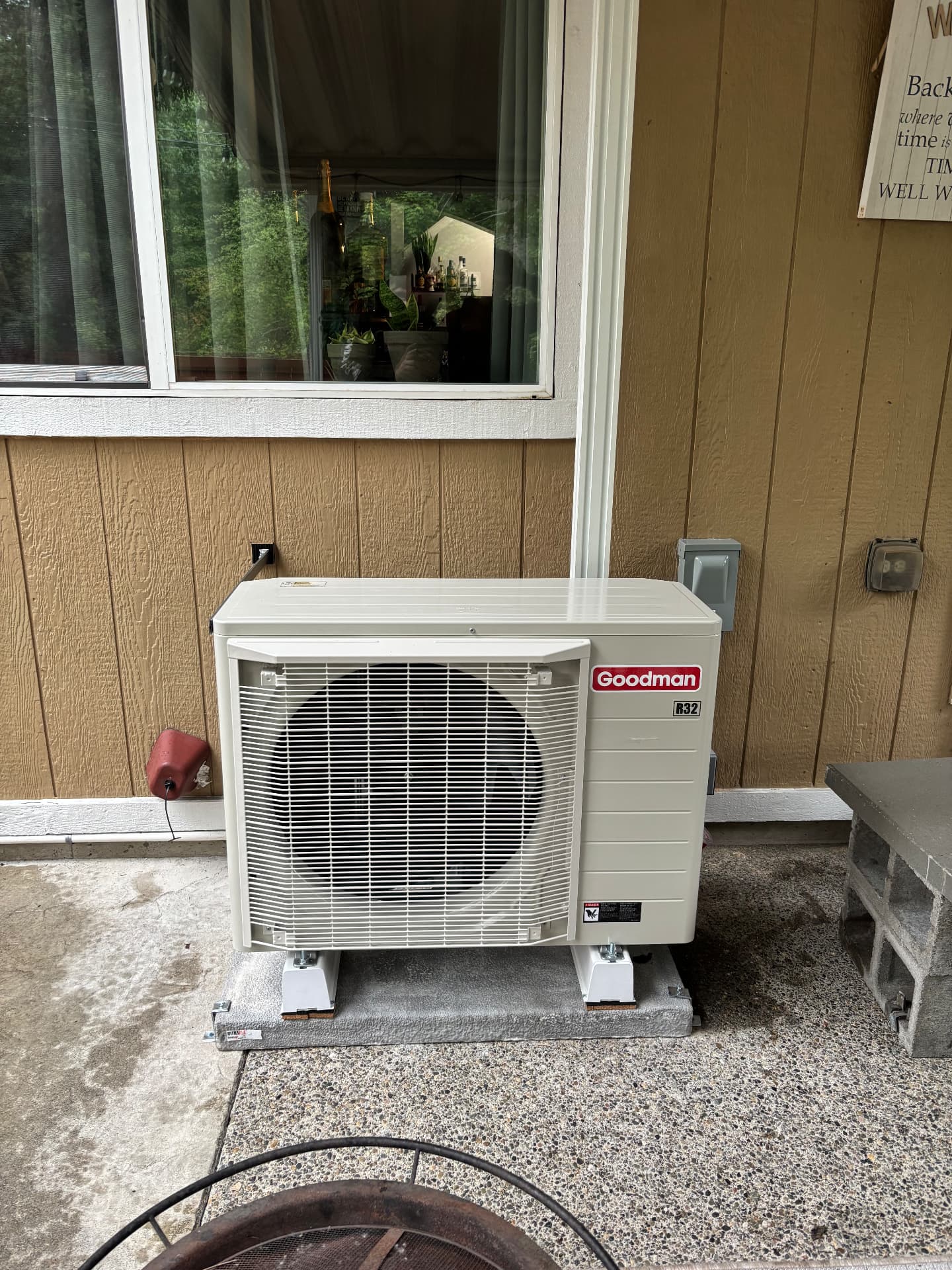 Goodman outdoor unit installed on a patio pad