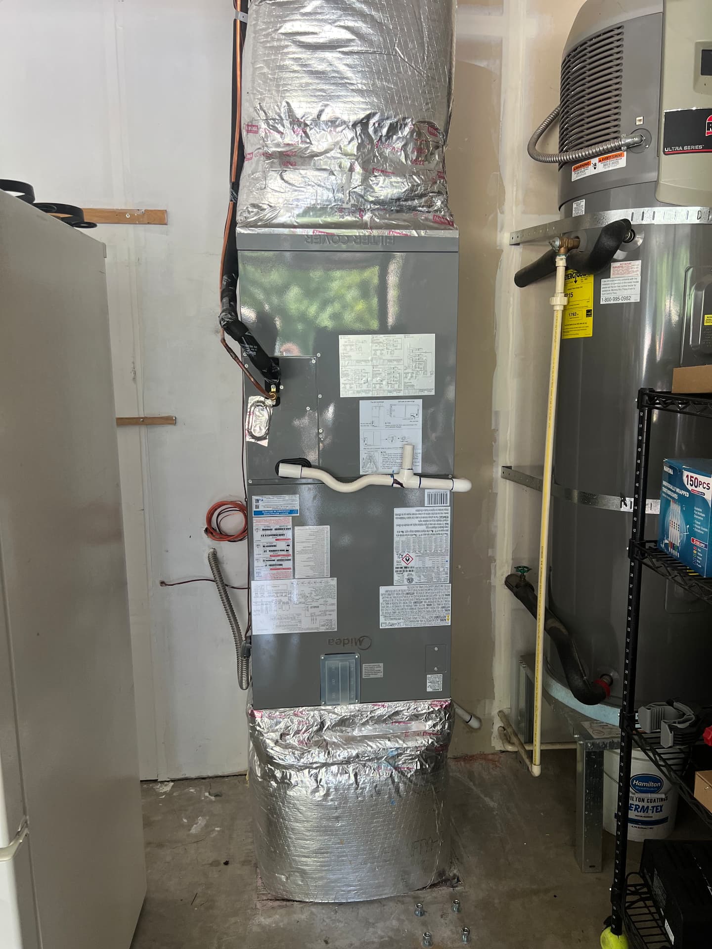 Midea indoor air handler installed in a utility room